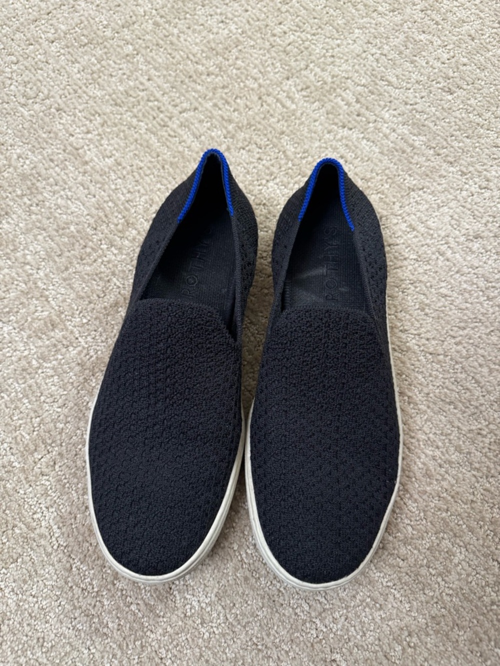 Rothy's Black Slip-On Knit Sneakers with Blue Accent